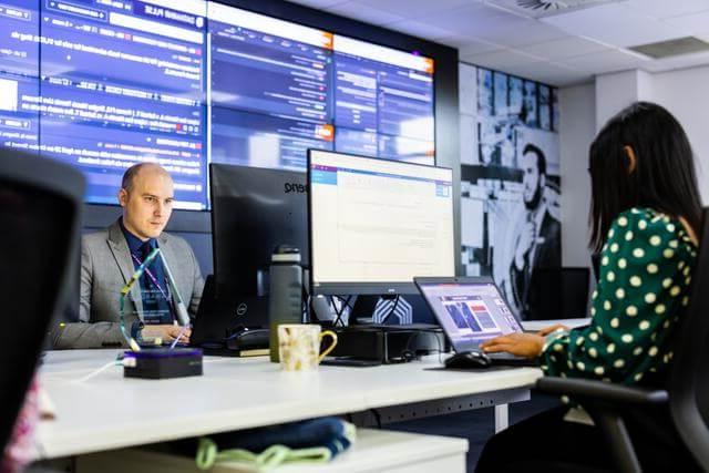 Mitie staff working at desks in the Mitie Intelligence Centre